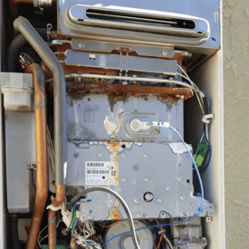 Tankless water heater with hard water scale build up inside of the water heater