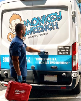 Monkey Wrench Plumbing Technician with his van
