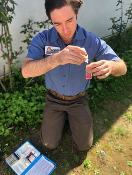 A monkey wrench technician testing water quality