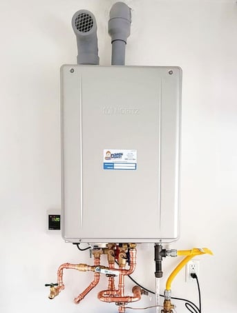 A tankless water heater installed by Monkey Wrench Plumbing
