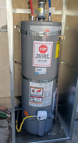 A traditional water heater installed by Monkey Wrench Plumbing