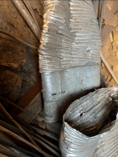 The image shows a ductwork that broke apart.