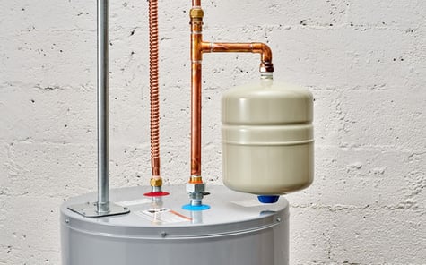 An expansion tank on a conventional water heater