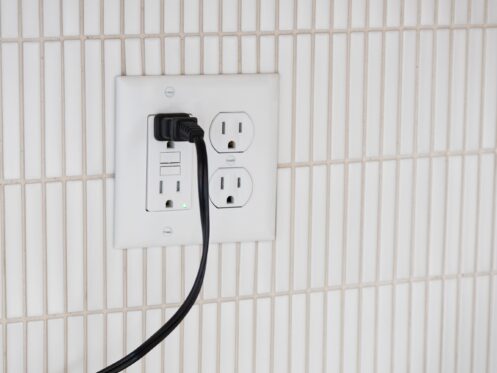 Power cord plugged into a GFCI electrical outlet