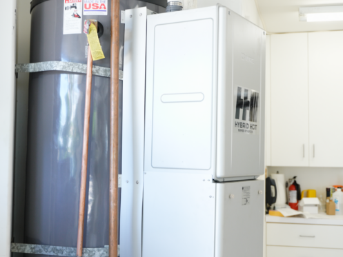 The image shows a side profile of the Noritz Hybrid Hot water heater.