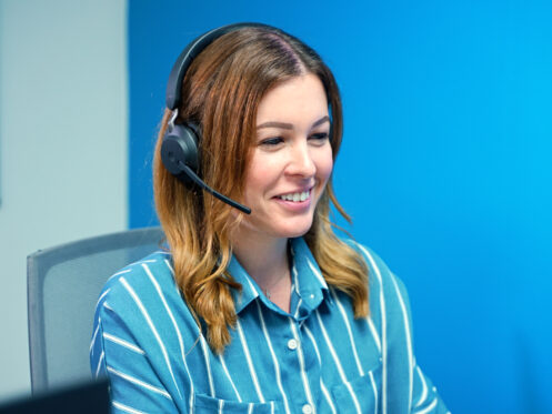 A Monkey Wrench call center representative taking a call from a homeowner.