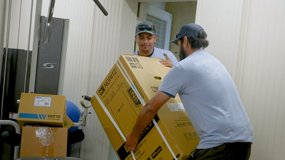 plumbers installing on noritz tankless water heater in Los Angeles