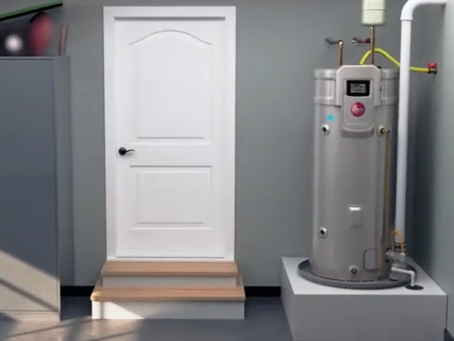 The image shows a Rheem tank-style water heater installed inside the garage of a home.