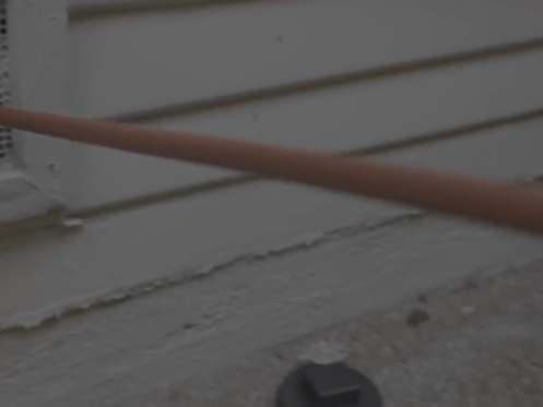 A snake line entering a pipe from outside a home.